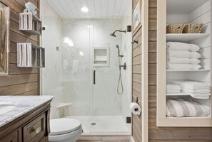 Shower, hair dryer, towels, soap
