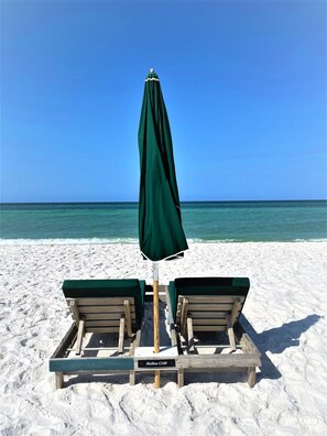 On the beach, sun-loungers