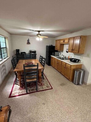 Fridge, microwave, coffee/tea maker, cookware/dishes/utensils