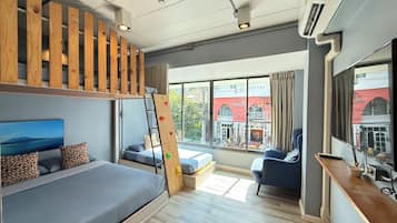 Deluxe Family Room | In-room safe, individually decorated, desk, laptop workspace