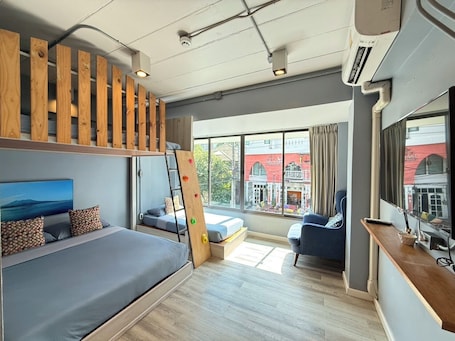 Deluxe Family Room | In-room safe, individually decorated, desk, laptop workspace. Ichiban Nimman Hotel