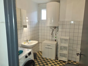 Shower, towels, soap, toilet paper