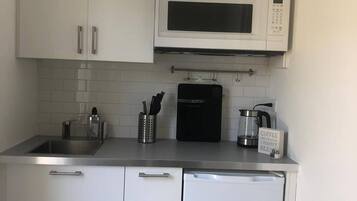 Microwave, coffee/tea maker, toaster, cookware/dishes/utensils