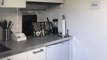 Microwave, coffee/tea maker, toaster, cookware/dishes/utensils