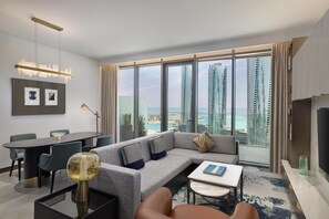 Premier Two Bedroom Suite Sea View | Living area | 65-inch Smart TV with digital channels, pay movies - Conrad Bahrain Financial Harbour (Manama)