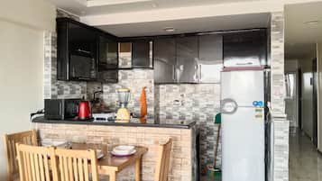 Fridge, microwave, stovetop, coffee/tea maker
