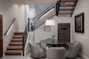 A staircase with wooden steps and metal railings, leading to an upper floor. - The Residence on South Oak - Downtown convenience!, Perfect location by gondola and private hot tub! (Telluride)