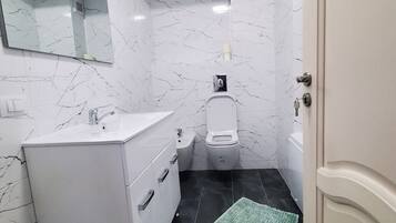 Bidet, towels, soap, shampoo