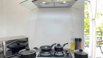 Fridge, microwave, stovetop, coffee/tea maker