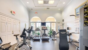 A gym with treadmills, stationary bikes, and a rowing machine. - Fort Myers Condo: Community Pool + Fitness Center (Fort Myers)