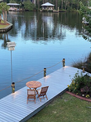 Relax by the serene lake with a deck, garden, and gazebo.