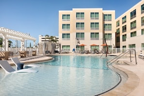 Outdoor pool, open 7:00 AM to 10:00 PM, free pool cabanas