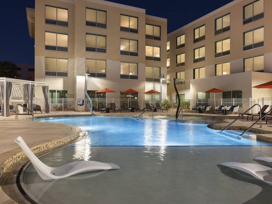 Outdoor pool, open 7:00 AM to 10:00 PM, free cabanas, pool umbrellas