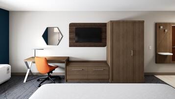 A modern hotel room with a bed, a desk with an orange chair, a wardrobe, a TV mounted on the wall, and a small shelf.