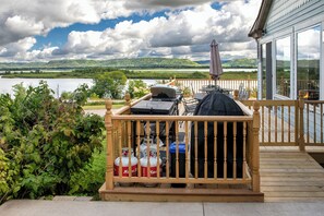 Terrace/patio - Discover ‘Riverview Radiance,' a 5BR Minneiska marvel where the Mississippi meets modern luxury.   Perfect for large groups, this home boasts a fully-equipped kitchen, sprawling views, and a suite of entertainment options. Revel in comfort with plush (Minnieska)
