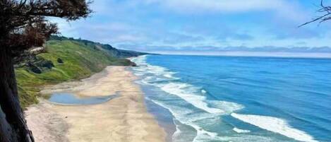 On the beach, sun-loungers, beach towels