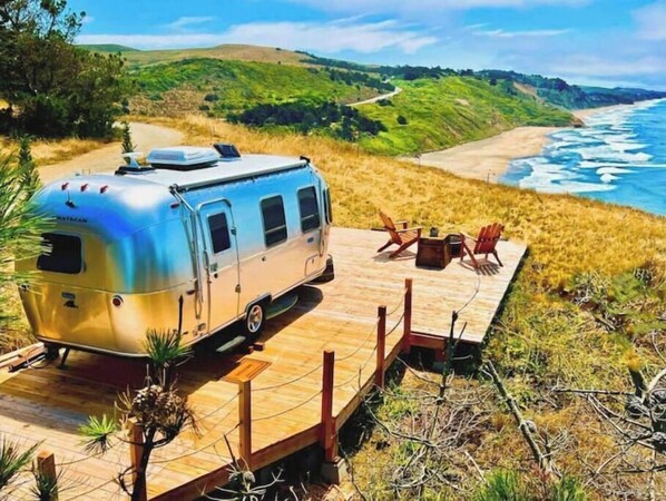 On the beach, sun-loungers, beach towels