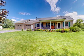 Exterior - Relaxing two-story home with a deck, firepit, game room, & washer/dryer (Penn Yan)
