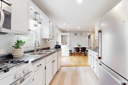 Relaxing two-story home with a deck, firepit, game room, & washer/dryer