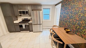 Fridge, microwave, oven, stovetop - The House on Park: 4 Bedroom/2 Bath Family-Friendly Home in the heart of Erie! (Erie)