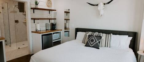 1 bedroom, desk, iron/ironing board, travel crib