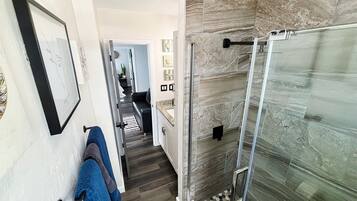 Shower, eco-friendly toiletries, hair dryer, towels