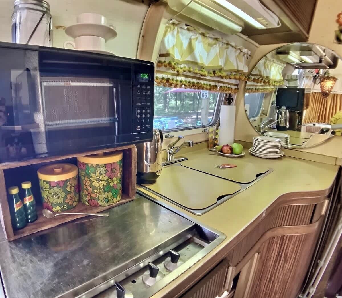 Fridge, microwave, coffee/tea maker, cookware/dishes/utensils