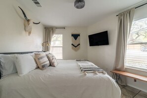 1 bedroom, desk, iron/ironing board, travel crib