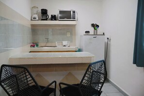 Fridge, microwave, stovetop, coffee/tea maker