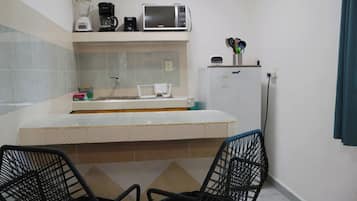 Fridge, microwave, stovetop, coffee/tea maker