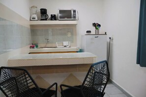 Fridge, microwave, stovetop, coffee/tea maker