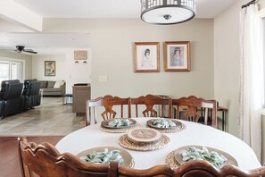 A dining area with a round table set for four, surrounded by wooden chairs. - Johnny Guitar Getaway, Discover the allure of West Sedona!! (Sedona)