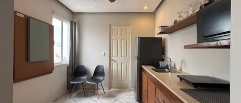 Fridge, microwave, stovetop, coffee/tea maker