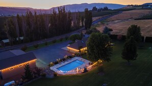 A residential property with a swimming pool, a garage, and a driveway. - Private luxury in beautiful Yakima wine and hop country (Naches)