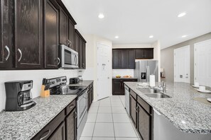 Private kitchen - Chic Resort Villa: Themed Rooms, Pool & Game Room! (Kissimmee)
