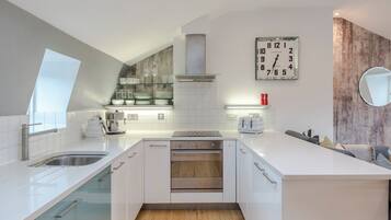 Dishwasher, high chair, cookware/dishes/utensils, dining tables