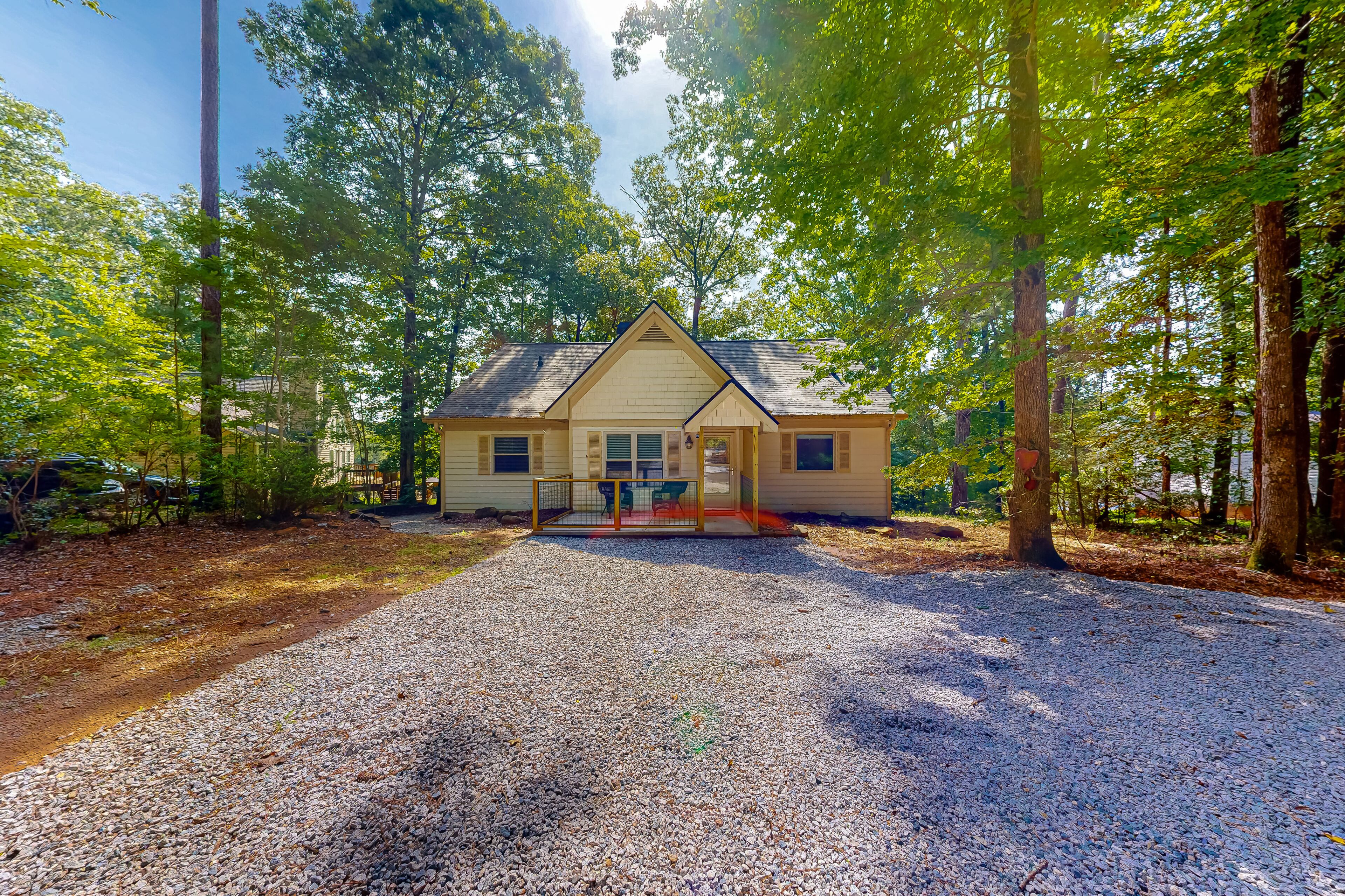 Inviting waterfront home with fireplace, dock, patio, central AC, & W/D