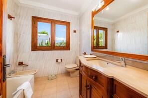 Bathtub, hair dryer, towels