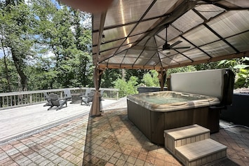 Covered hot tub and large deck overlooking the pond on 2-acres