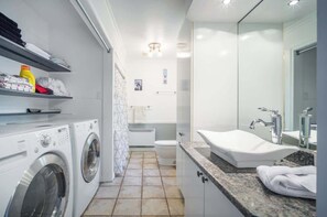 Bathtub, hair dryer, shampoo