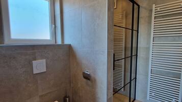 Shower, towels, soap, toilet paper