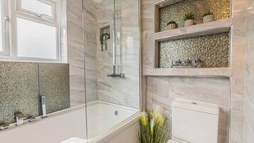 Bathtub, hair dryer, towels