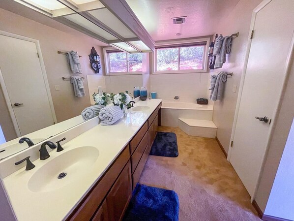 A bathroom with a large mirror, two sinks, a bathtub, and a window. - 3-acre Private Designer Villa-borders Forest-forever Views (Sedona)