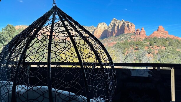 A hanging chair with a view of red rock formations. - Designer View Villa-rooftop 360 View Deck-hot Tub (Sedona)