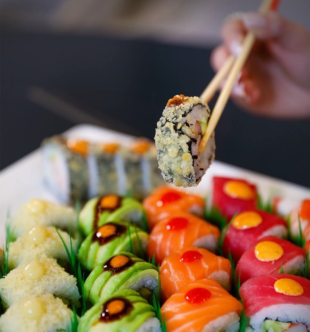 A variety of sushi rolls and nigiri on a platter.