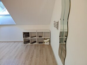 Basic Suite, 2 Double Beds | Bathroom | Shower, free toiletries, hair dryer, towels