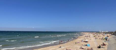 On the beach, sun-loungers