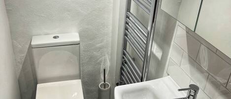 Hair dryer, towels, soap, toilet paper