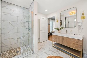 Bathtub, hair dryer, towels, shampoo