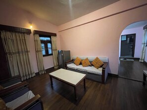 Deluxe-Doppel- oder -Zweibettzimmer | Wohnbereich